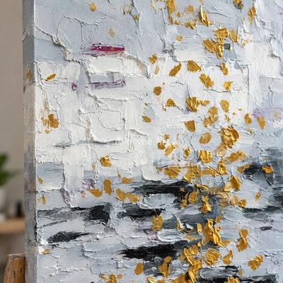 Close-up of the hand-painted texture of Gentle Measure ivory gold relief wall art on an easel