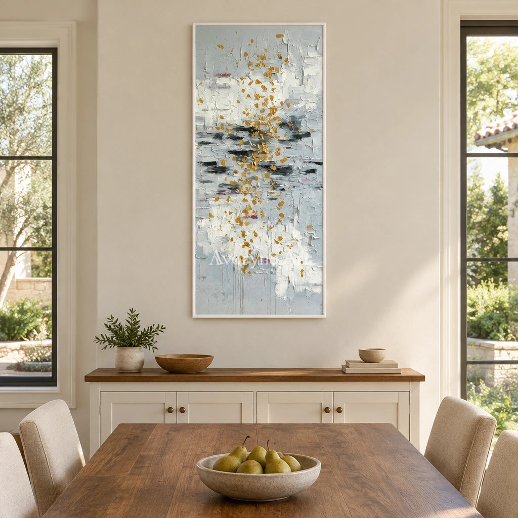 Gentle Measure ivory gold relief wall art with a white frame in a dining room