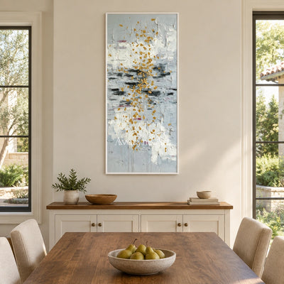Gentle Measure ivory gold relief wall art with a white frame in a dining room