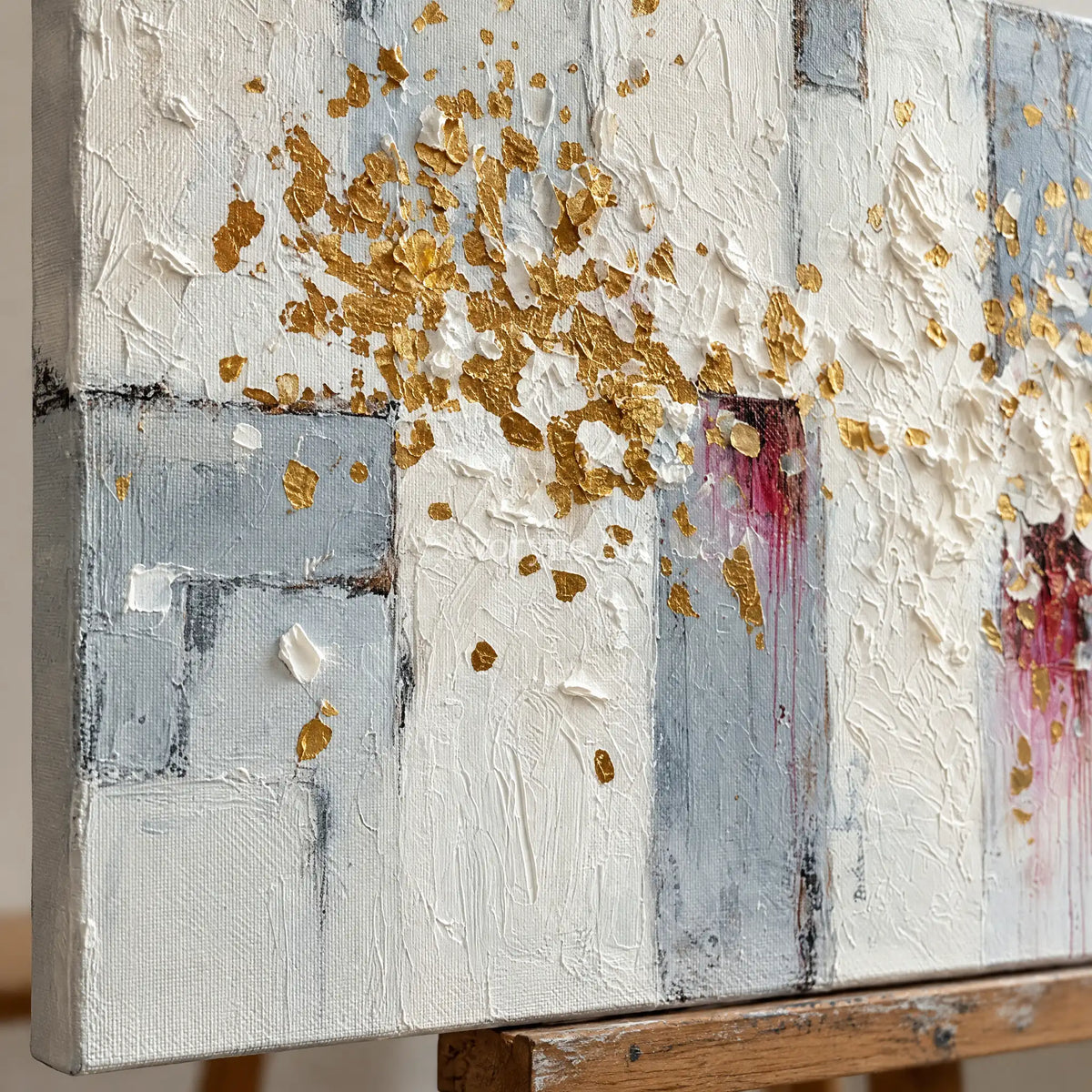Close-up of the hand-painted texture of Gentle Sonata ivory gold relief wall art on an easel