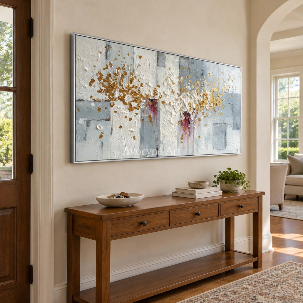 Gentle Sonata ivory gold relief wall art with a silver frame in an entryway