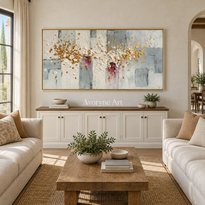 Gentle Sonata ivory gold relief wall art with a gold frame hanging in a living room