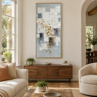 Lucent Refrain ivory gold relief wall art with a gold frame hanging in a living room