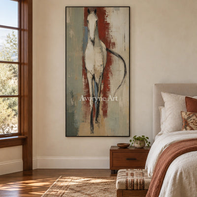 Woven Trace ivory horse art with a black frame above a bed in a bedroom