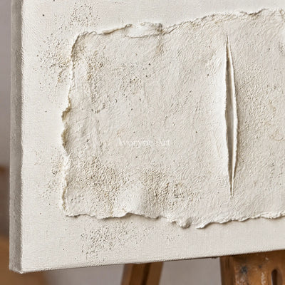 Close-up of the hand-painted texture of Woven Cadence ivory layered relief wall art on an easel