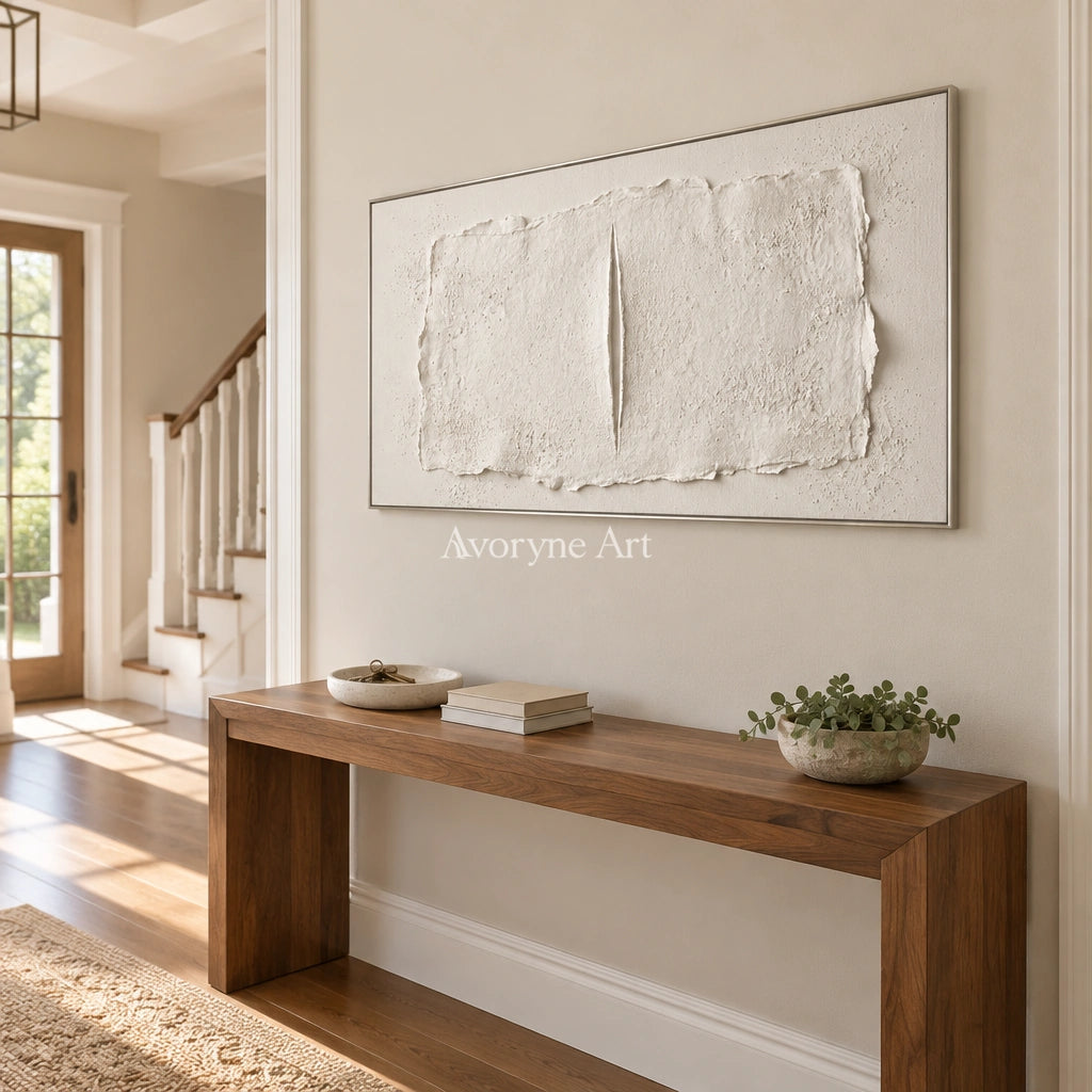 Woven Cadence ivory layered relief wall art with a silver frame in an entryway