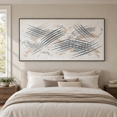 Golden Cadence linear abstract wall art with a black frame above a bed in a bedroom
