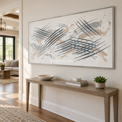 Golden Cadence linear abstract wall art with a silver frame in an entryway