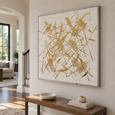 Golden Prelude linear abstract wall art with a silver frame in an entryway