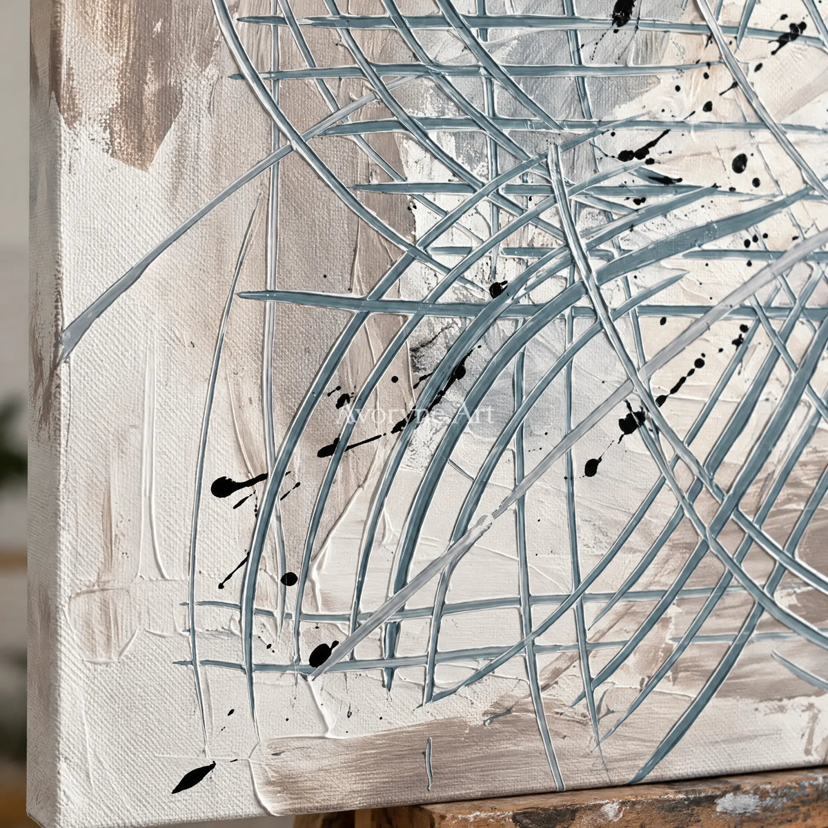 Close-up of the hand-painted texture of Golden Story linear abstract wall art on an easel