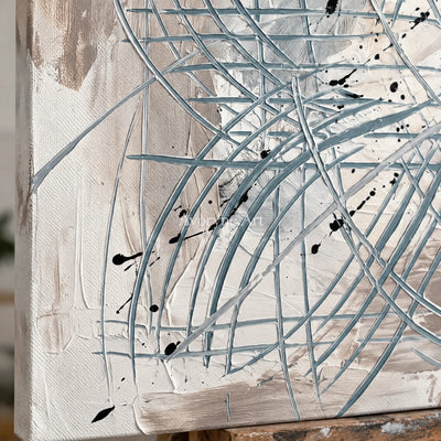 Close-up of the hand-painted texture of Golden Story linear abstract wall art on an easel
