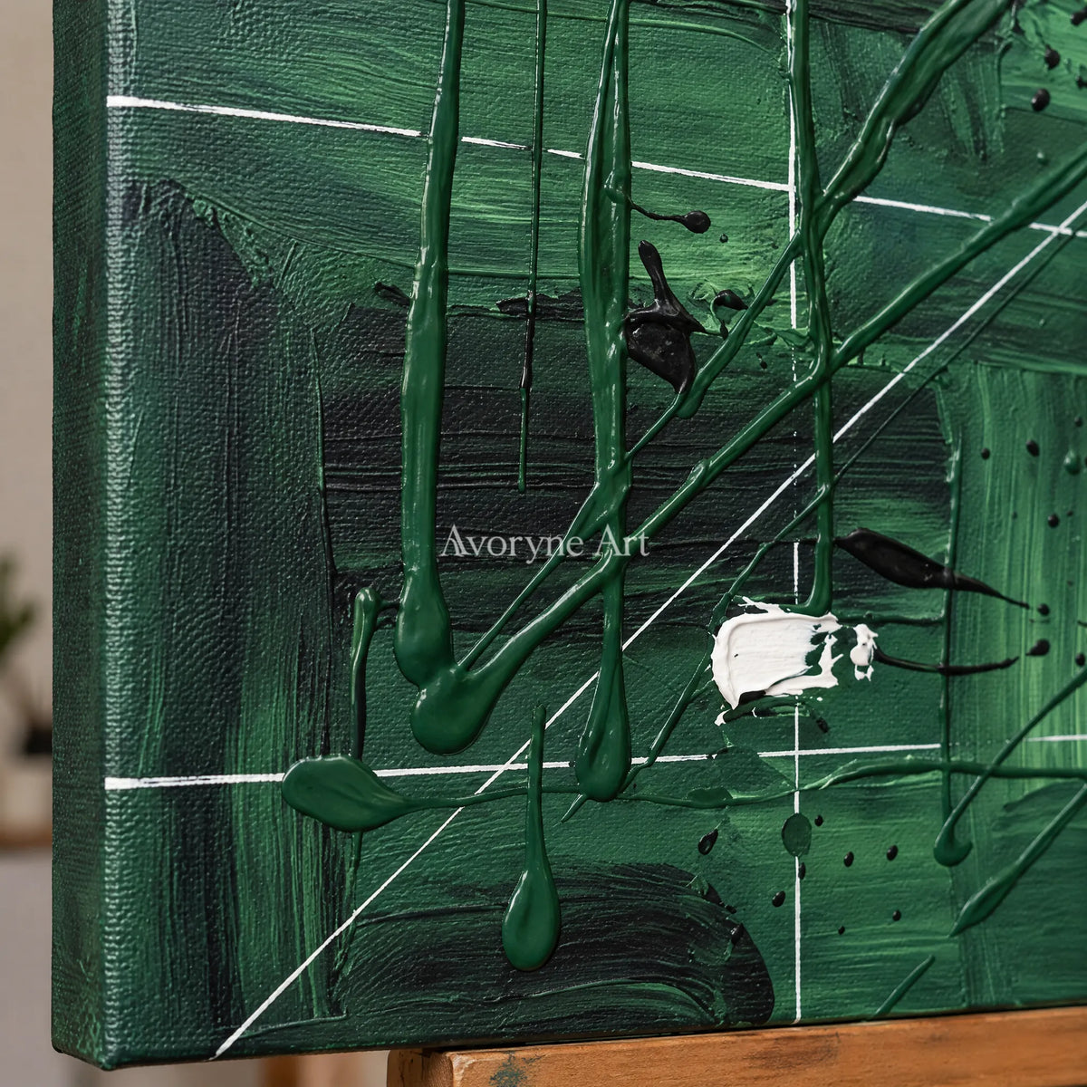 Close-up of the hand-painted texture of Golden Reverberation linear abstract wall art on an easel