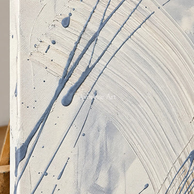 Close-up of the hand-painted texture of Golden Dialogue linear abstract wall art on an easel