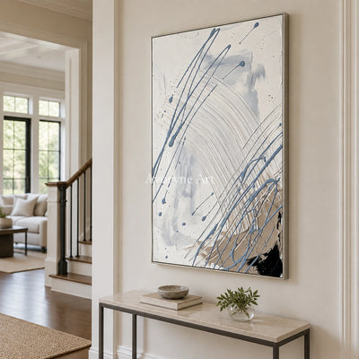 Golden Dialogue linear abstract wall art with a silver frame in an entryway