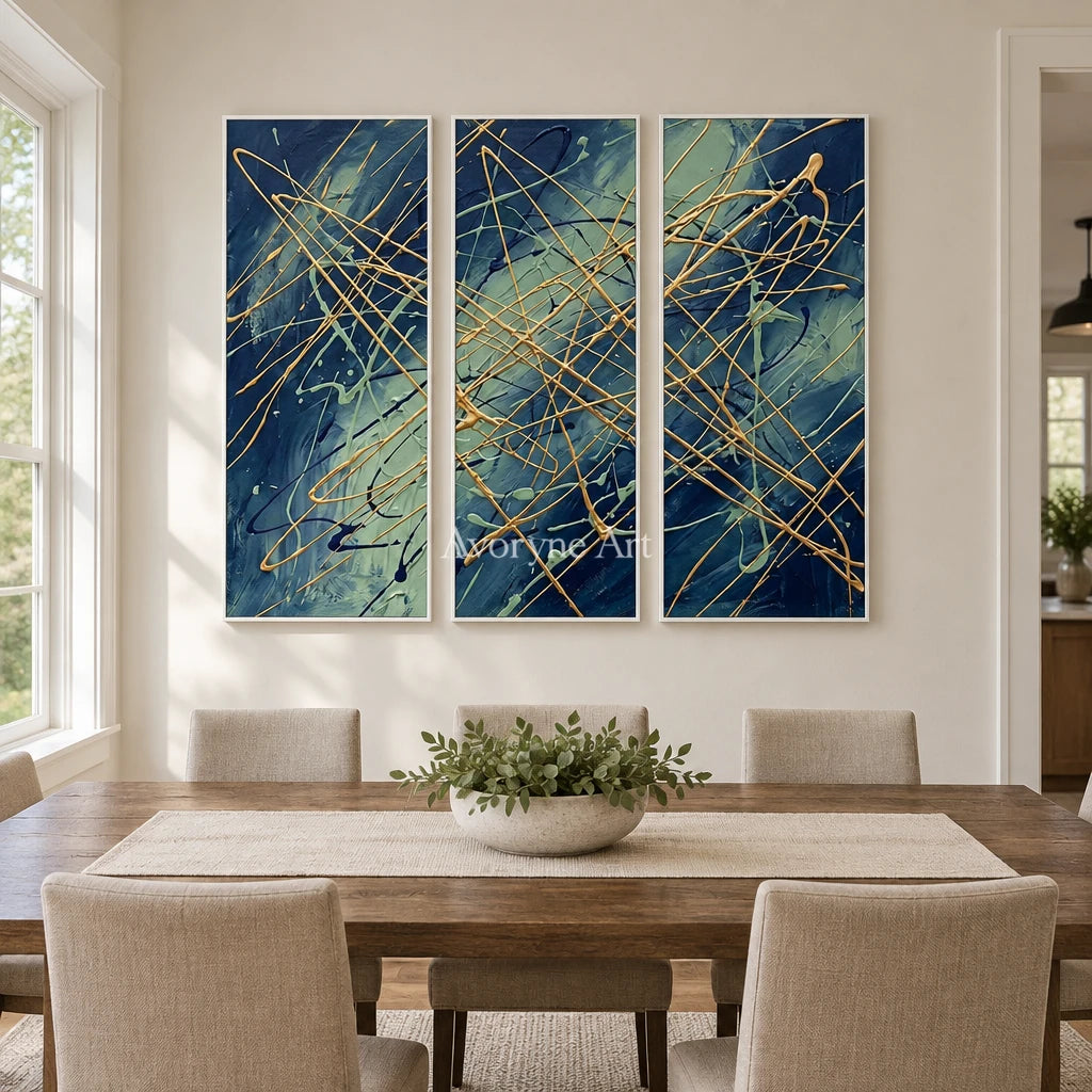 Silver Vista linear abstract triptych with a white frame in a dining room
