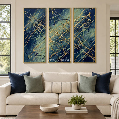 Silver Vista linear abstract triptych with a gold frame hanging in a living room