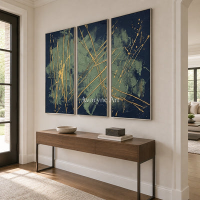 Silver Solace linear abstract triptych with a silver frame in an entryway