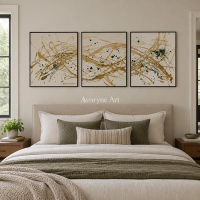 Golden Reverie linear abstract triptych with a black frame above a bed in a bedroom