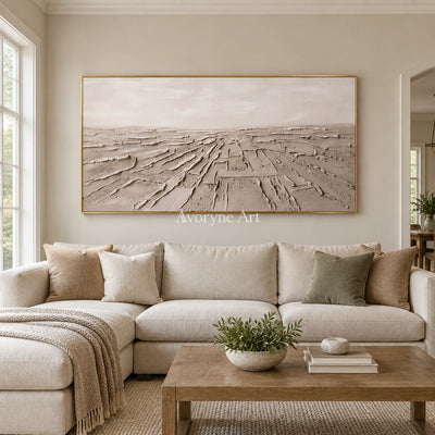 Soft Verse mineral texture wall art with a gold frame hanging in a living room