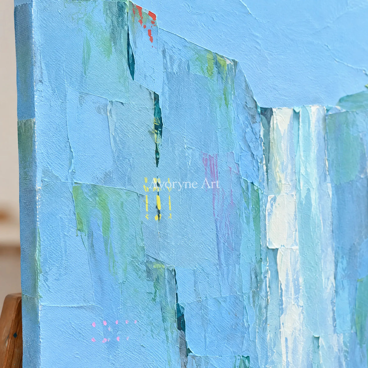 Close-up of the hand-painted texture of Tender Mosaic mountain landscape wall art on an easel