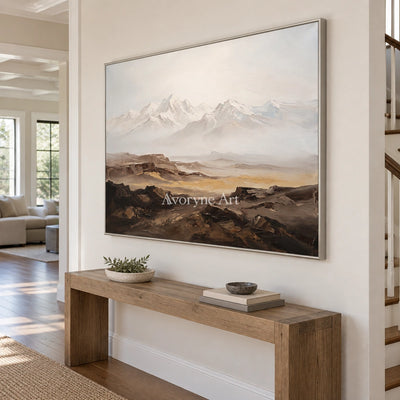 Winding Horizon mountain landscape wall art with a silver frame in an entryway