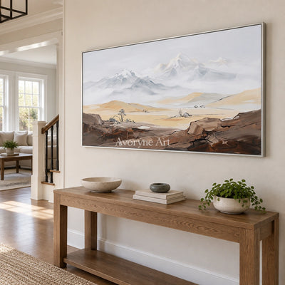 Winding Memory mountain landscape wall art with a silver frame in an entryway