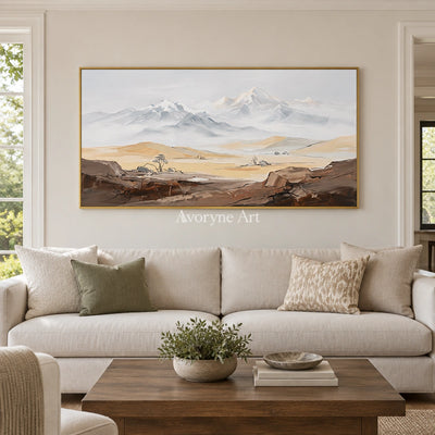 Winding Memory mountain landscape wall art with a gold frame hanging in a living room