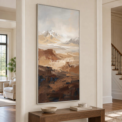 Winding Prelude mountain landscape wall art with a silver frame in an entryway