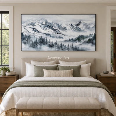 Silver Prelude mountain landscape wall art with a black frame above a bed in a bedroom