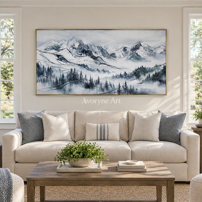 Silver Prelude mountain landscape wall art with a gold frame hanging in a living room