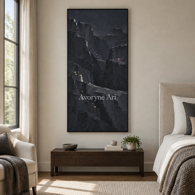 Still Dialogue mountain relief wall art with a black frame above a bed in a bedroom