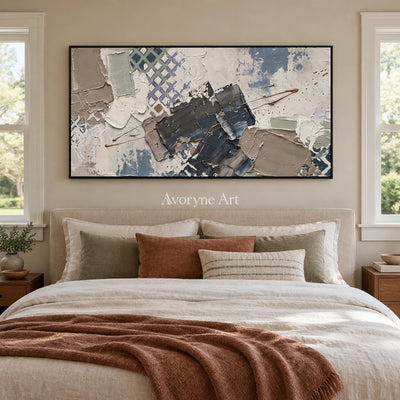 Earthen Verse muted geometric art with a black frame above a bed in a bedroom
