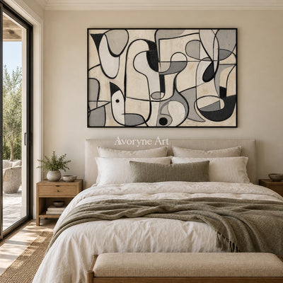 Woven Reverie muted organic abstract wall art with a black frame above a bed in a bedroom