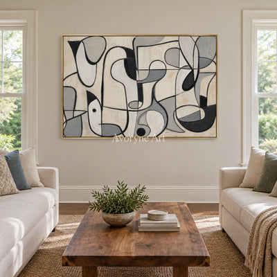 Woven Reverie muted organic abstract wall art with a gold frame hanging in a living room
