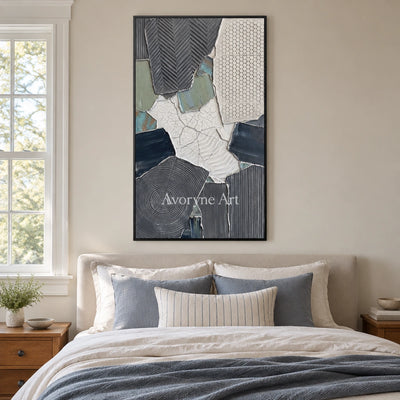 Mineral Memory muted patchwork texture wall art with a black frame above a bed in a bedroom