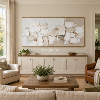 Misted Interval neutral block relief wall art with a gold frame hanging in a living room