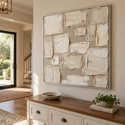 Misted Verse neutral block relief wall art with a silver frame in an entryway