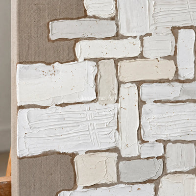 Close-up of the hand-painted texture of Misted Current neutral block relief wall art on an easel