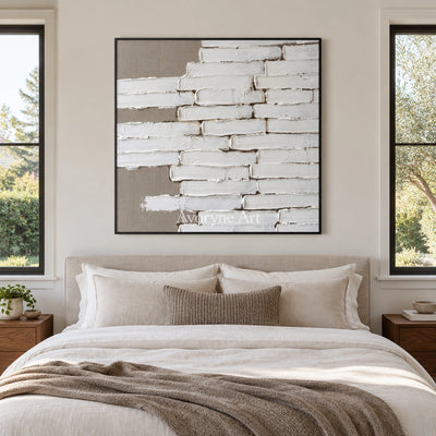 Misted Gesture neutral block relief wall art with a black frame above a bed in a bedroom
