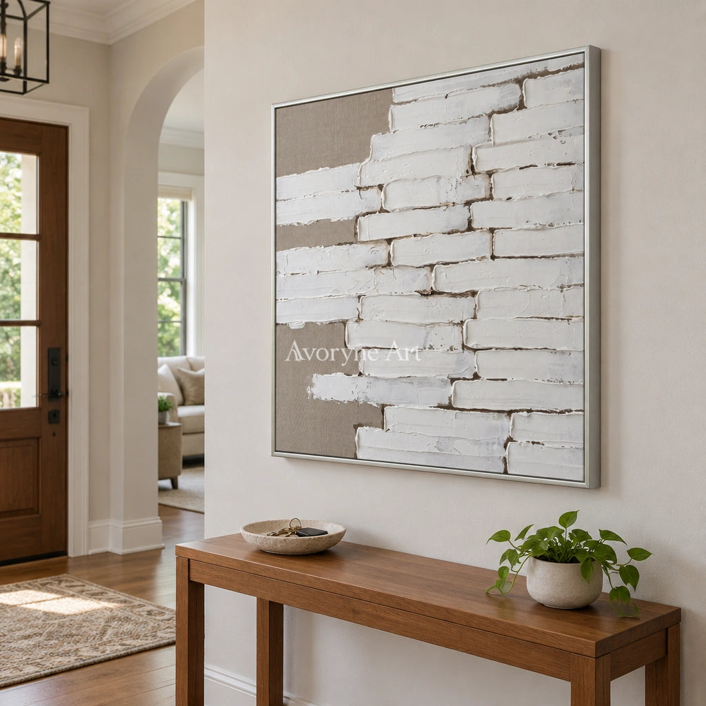 Misted Gesture neutral block relief wall art with a silver frame in an entryway
