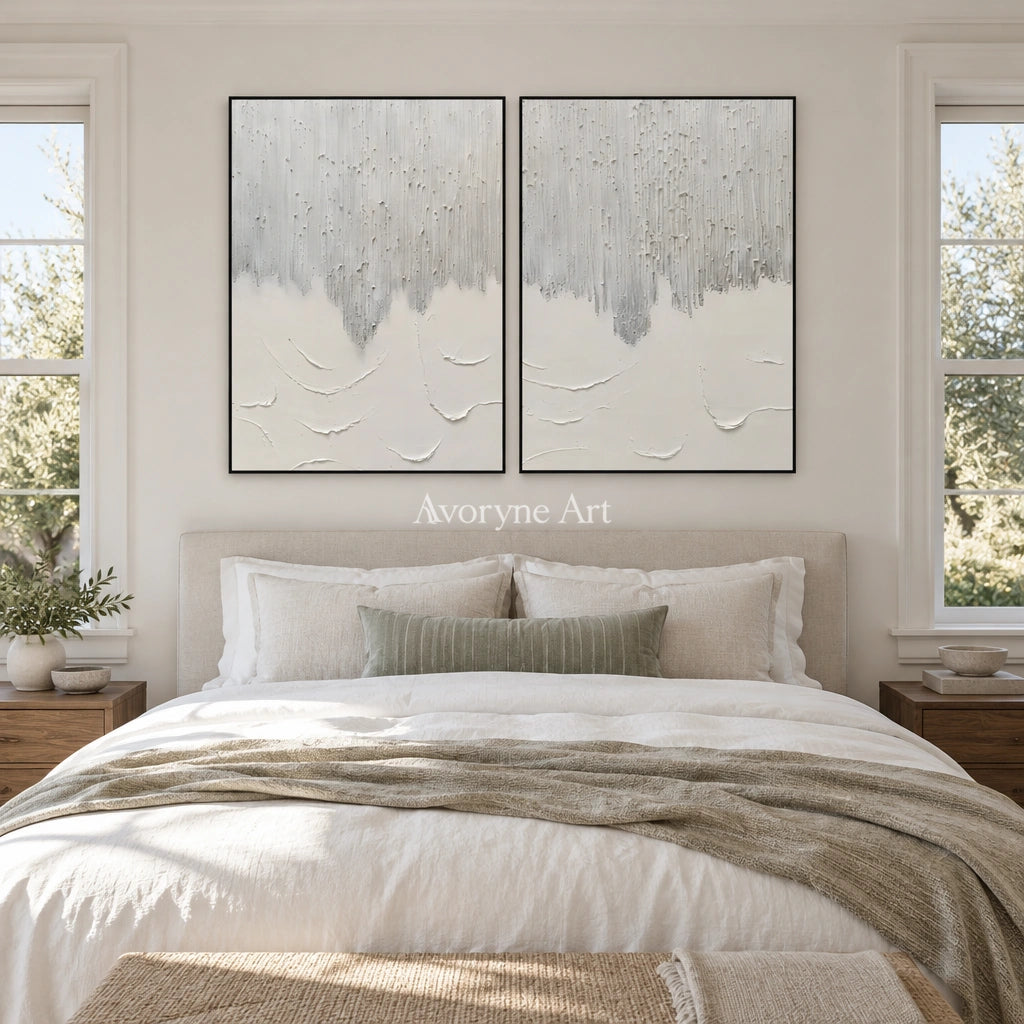 Muted Gesture neutral fold relief diptych with a black frame above a bed in a bedroom