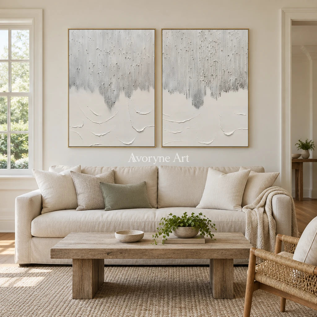 Muted Gesture neutral fold relief diptych with a gold frame hanging in a living room