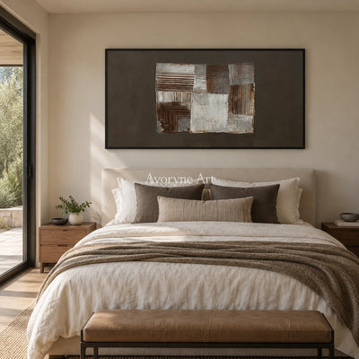 Hushed Refrain neutral geometric relief wall art with a black frame above a bed in a bedroom