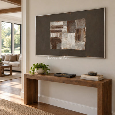 Hushed Refrain neutral geometric relief wall art with a silver frame in an entryway