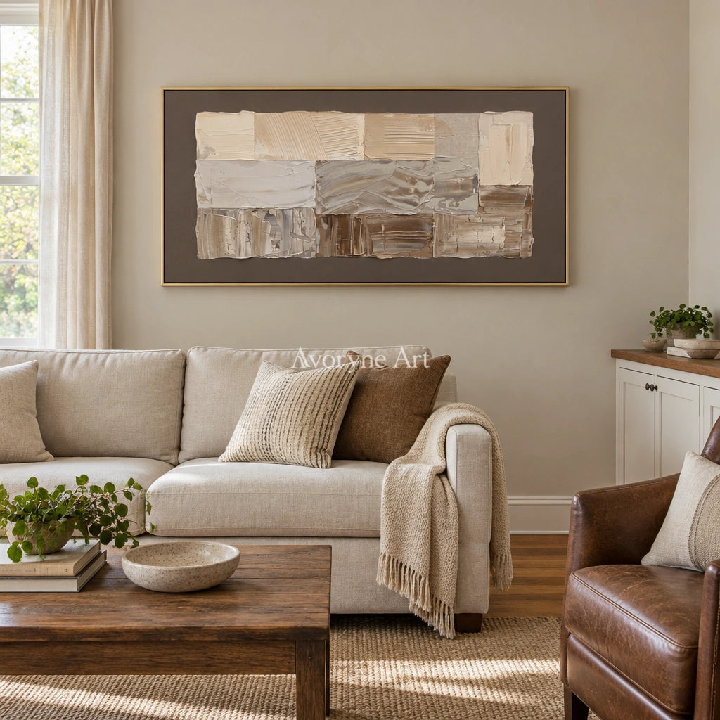 Hushed Interval neutral geometric relief wall art with a gold frame hanging in a living room