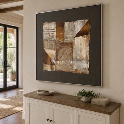 Hushed Verse neutral geometric relief wall art with a silver frame in an entryway