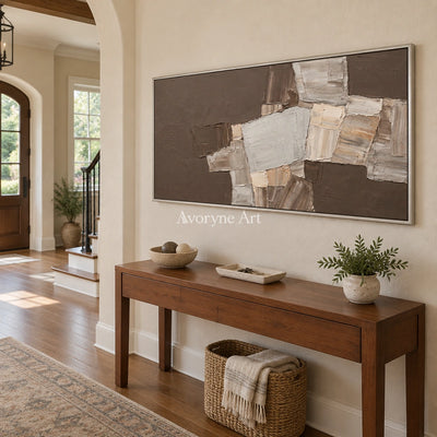 Hushed Sonata neutral geometric relief wall art with a silver frame in an entryway