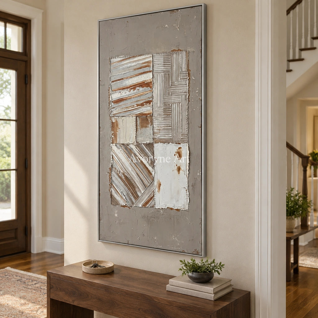 Mineral Measure neutral geometric relief wall art with a silver frame in an entryway
