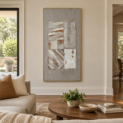Mineral Measure neutral geometric relief wall art with a gold frame hanging in a living room