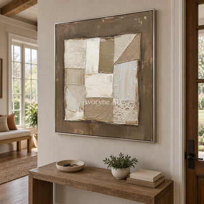 Mineral Echo neutral geometric relief wall art with a silver frame in an entryway